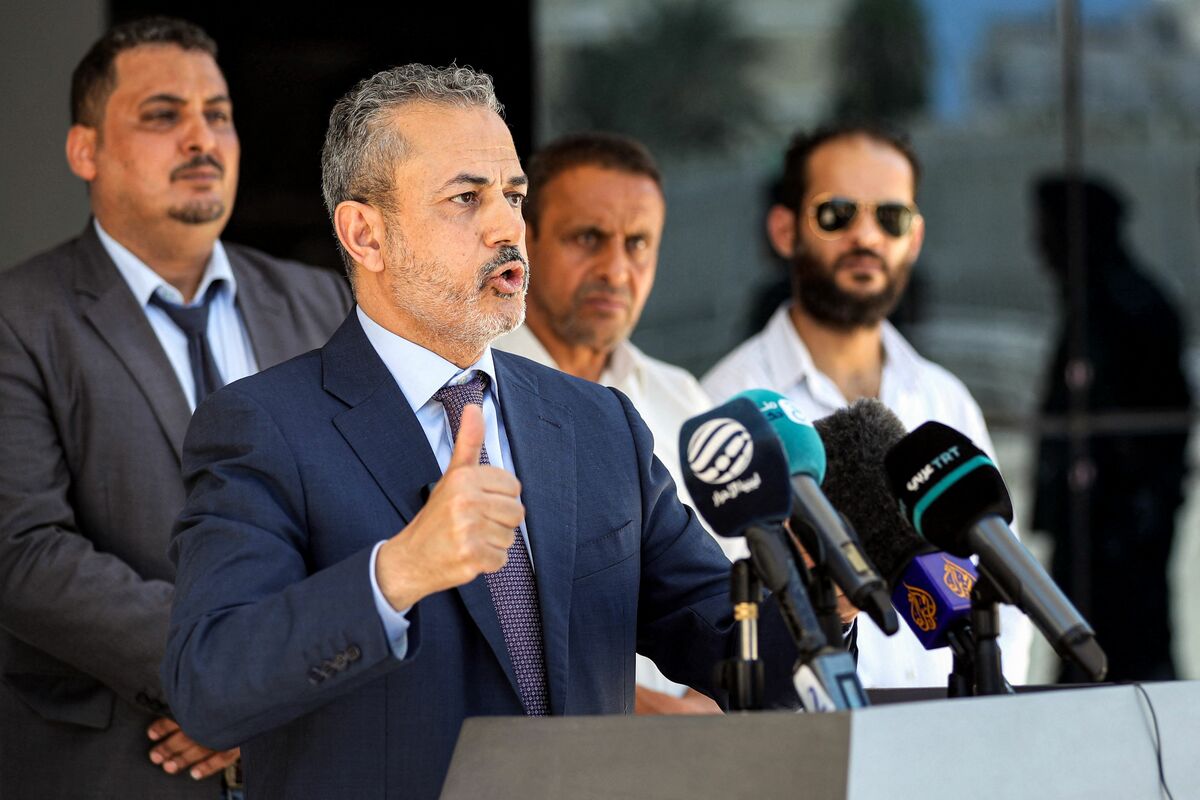 Farhat Bengdara, the new chief of Libya's National Oil Corporation who was appointed by the Tripoli-based Prime Minister Abdulhamid Dbeibah, gives a press conference outside the corporation's headquarters in the capital Tripoli on July 14, 2022. The new chief took office at Libya's National Oil Corporation on July 14 in place of veteran technocrat Sanalla, prompting the United States to warn against any "armed confrontation" over the vital sector. Oil is often at the heart of political rivalries in Libya, which has two governments, one in Tripoli led by Abdulhamid Dbeibah, appointed last year as part of a United Nations-backed peace process aimed to end more than a decade of violence in the North African country. (Photo by Mahmud Turkia / AFP)