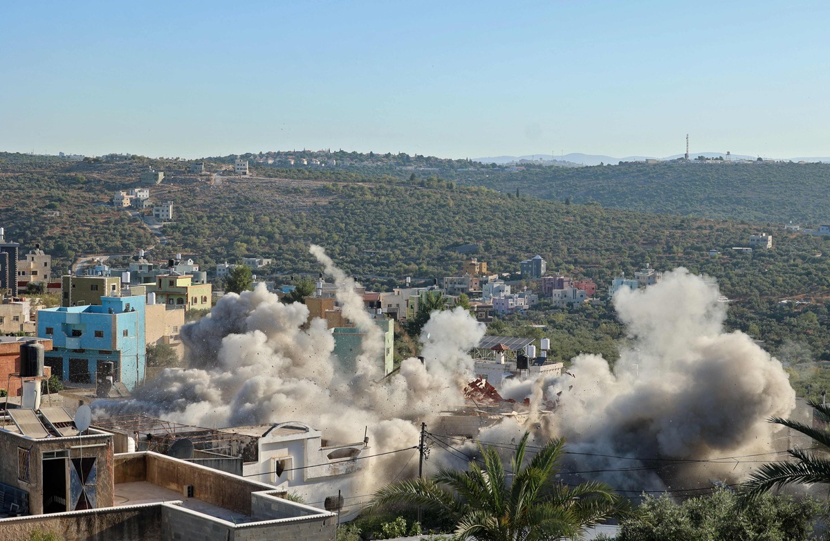 Israeli army demolish the house of Palestinian detainee Yehya Miri, in the village of Qarawat Bani Hassan in the Israeli-occupied West Bank July 26, 2022. (Photo by JAAFAR ASHTIYEH / AFP)