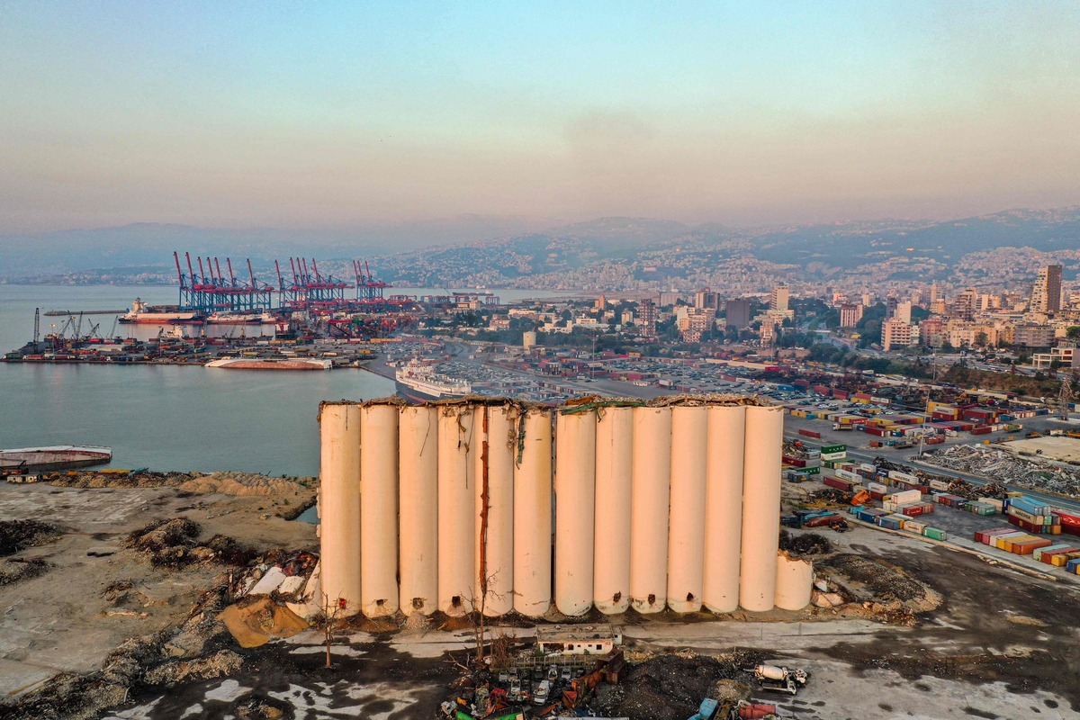 This aerial view shows the damaged grain silos at the port of the Lebanese capital Beirut, on August 3, 2022, following a partial collapse due to an ongoing fire since the beginning of the month. On August 4, Lebanon will mark two years since the port's massive explosion that killed more than 200 people. It was caused by a stockpile of haphazardly stored ammonium nitrate fertiliser catching fire. The silos, had shielded the western part of the Lebanese capital when the catastrophic blast took place two years ago. (Photo by AFP)