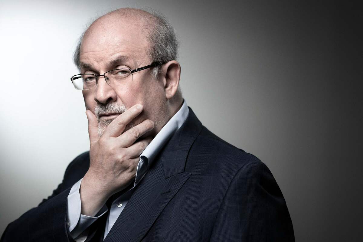 (FILES) In this file photo taken on September 10, 2018, British novelist and essayist Salman Rushdie poses during a photo session in Paris. Salman Rushdie, who spent years in hiding after an Iranian fatwa ordered his killing, was on a ventilator and could lose an eye following a stabbing attack at a literary event in New York state on August 11, 2022. (Photo by JOEL SAGET / AFP)