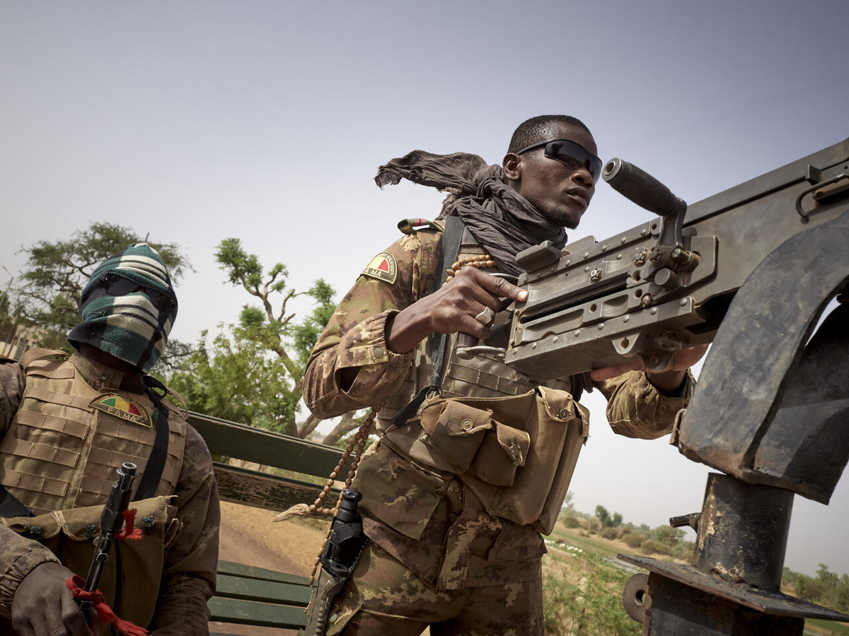 Soldiers of the Malian army are seen during a patrol on the road between Mopti and Djenne, in central Mali, on February 28, 2020. A week earlier Prime Minister Boubou Cisse announced the dismantling of all the security checkpoints organized by the traditional militia hunters Dan Na Ambassagaou so that the army could re-establish the security conditions along the main streets in central Mali.