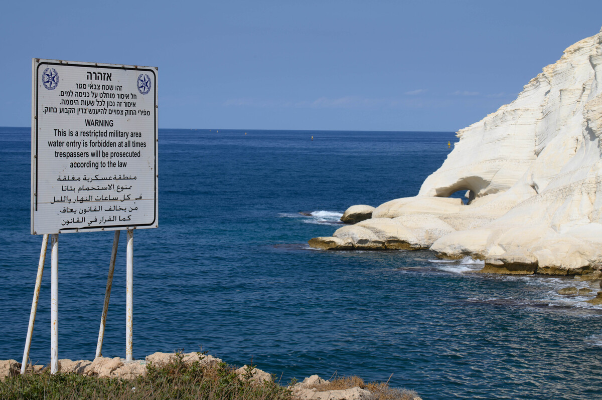 (221007) -- ROSH HANIKRA, Oct. 7, 2022 (Xinhua) -- A warning sign is seen by the sea in northern Israel's Rosh Hanikra bordering Lebanon, Oct. 7, 2022. Israeli Defense Minister Benny Gantz on Thursday instructed the defense establishment to prepare for any possible escalation with Lebanon hours after Israel rejected Lebanon's amendments to the U.S.-brokered proposal for demarcating a maritime border. (Ayal Margolin/JINI via Xinhua)