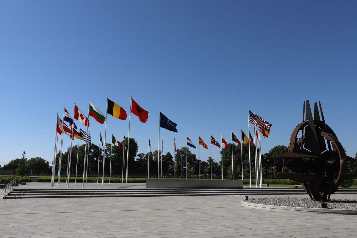 A photo taken on June 15, 2022, shows member countries' flags at the North Atlantic Treaty Organization (NATO) headquarters in Brussels, Belgium. (Photo by Valeria Mongelli / AFP)