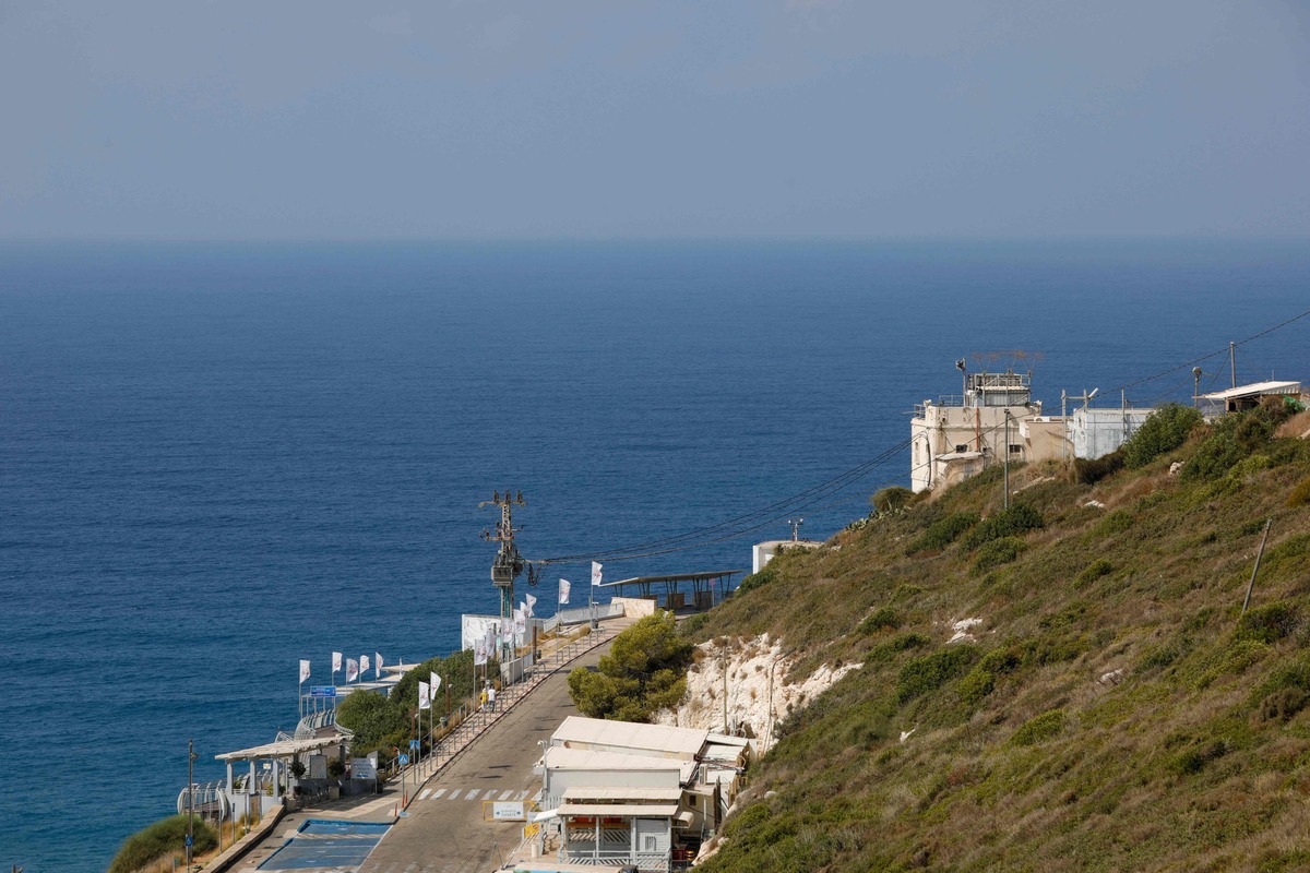 A picture shows a view of an Israeli military base at Rosh Hanikra, known in Lebanon as Ras al-Naqura, at the border between the two coutries, on October 4, 2022. Lebanon said a day earlier it will send remarks to Washington's proposal to resolve a maritime border dispute with Israel, with which it is technically still at war, over gas-rich waters. (Photo by JALAA MAREY / AFP)