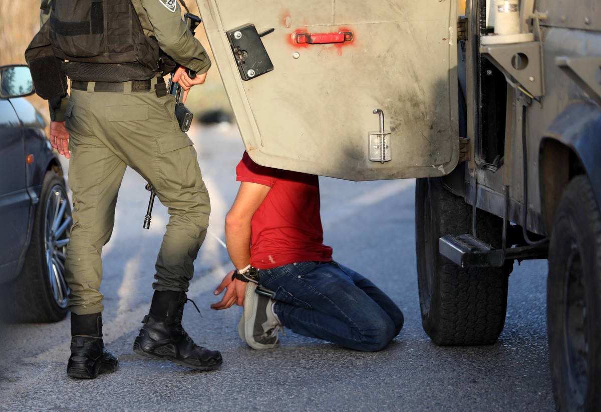 (220531) -- QALQILYA, May 31, 2022 (Xinhua) -- A Palestinian man is detained following a protest against the expansion of Jewish settlements in the village of Izbat at-Tabib near the West Bank city of Qalqilya, on May 31, 2022. (Photo by Ayman Nobani/Xinhua)