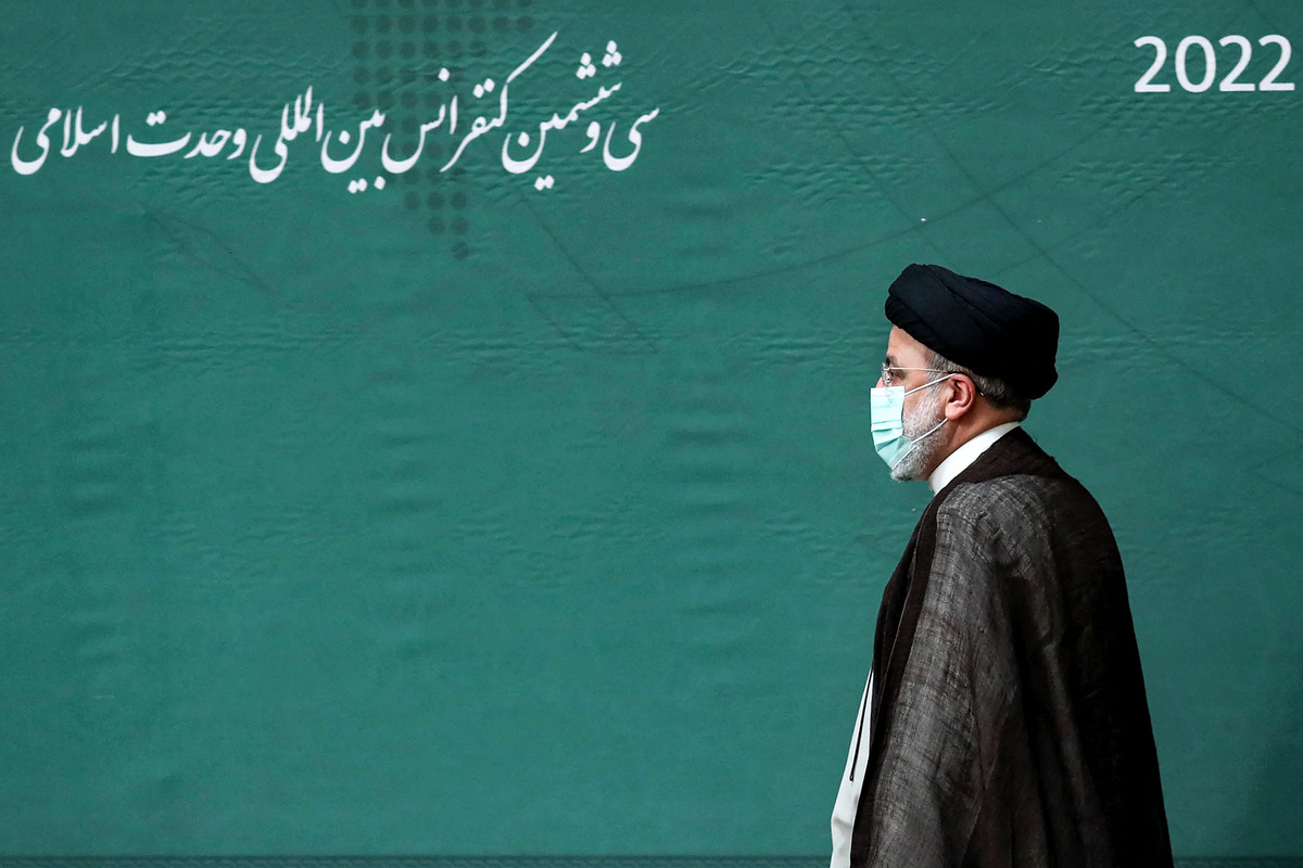 This handout picture provided by the Iranian presidency on October 12, 2022 shows Iran's President Ebrahim Raisi arriving to address delegates attending the 36th annual International Islamic Unity Conference in the capital Tehran. - === RESTRICTED TO EDITORIAL USE - MANDATORY CREDIT "AFP PHOTO / HO / IRANIAN PRESIDENCY" - NO MARKETING NO ADVERTISING CAMPAIGNS - DISTRIBUTED AS A SERVICE TO CLIENTS === (Photo by IRANIAN PRESIDENCY / AFP) / === RESTRICTED TO EDITORIAL USE - MANDATORY CREDIT "AFP PHOTO / HO / IRANIAN PRESIDENCY" - NO MARKETING NO ADVERTISING CAMPAIGNS - DISTRIBUTED AS A SERVICE TO CLIENTS ===