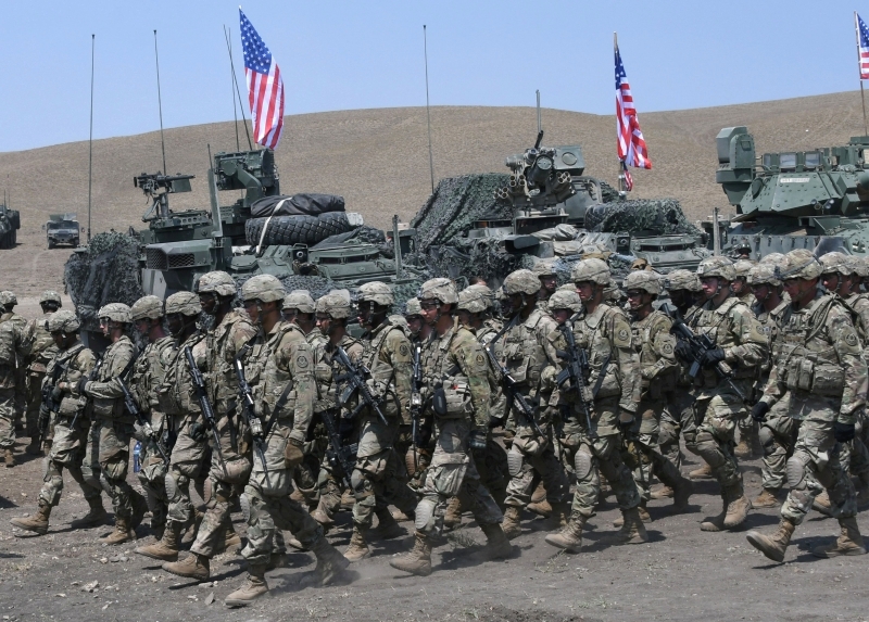 US soldiers march during the official closing ceremony of the multinational military exercise 'Noble Partner 2017' at the military base of Vaziani, outside Tbilisi, Georgia, on August 12, 2017. The Noble Partner 2017 is large scale exercise with engagement of NATO members and partner countries: Georgia, USA, UK, Germany, Turkey, Slovenia, Armenia and Ukraine. / AFP / Vano Shlamov