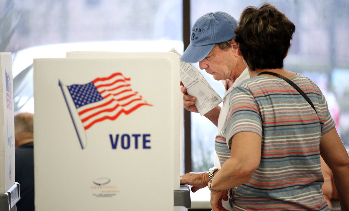 A voter casts his ballot at the Orange County Supervisor of Elections headquarters one day ahead of the US midterm elections in Orlando, Florida on November 7, 2022. (Photo by Gregg Newton / AFP)