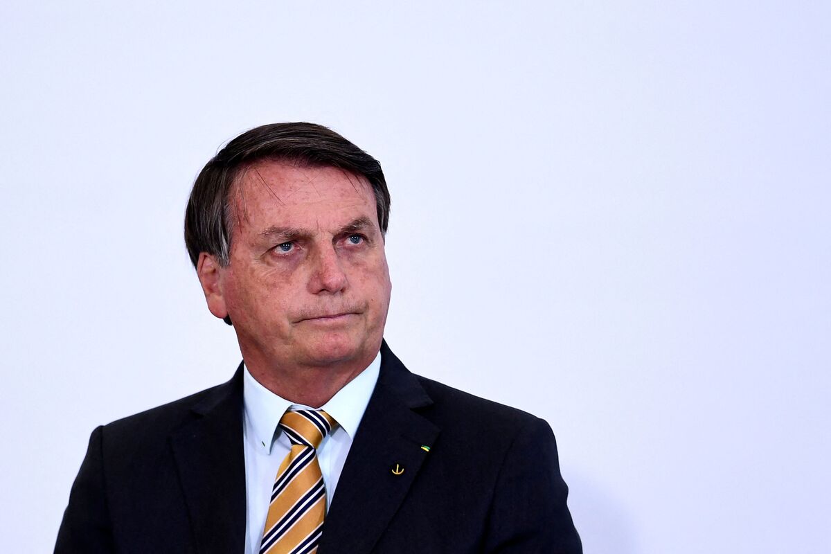 (FILES) In this file photo taken on November 10, 2020, Brazilian President Jair Bolsonaro gestures during the launch of a program for the resumption of tourism, a sector severely affected by the new coronavirus outbreak, at Planalto Palace in Brasilia. Jair Bolsonaro's Liberal Party (PL) asked the Brazilian electoral court on Tuesday November 22, 2022, to invalidate the votes of some 280,000 ballot boxes used in the runoff on October 30, alleging alleged errors that would have given Lula victory over the current President. (Photo by EVARISTO SA / AFP)