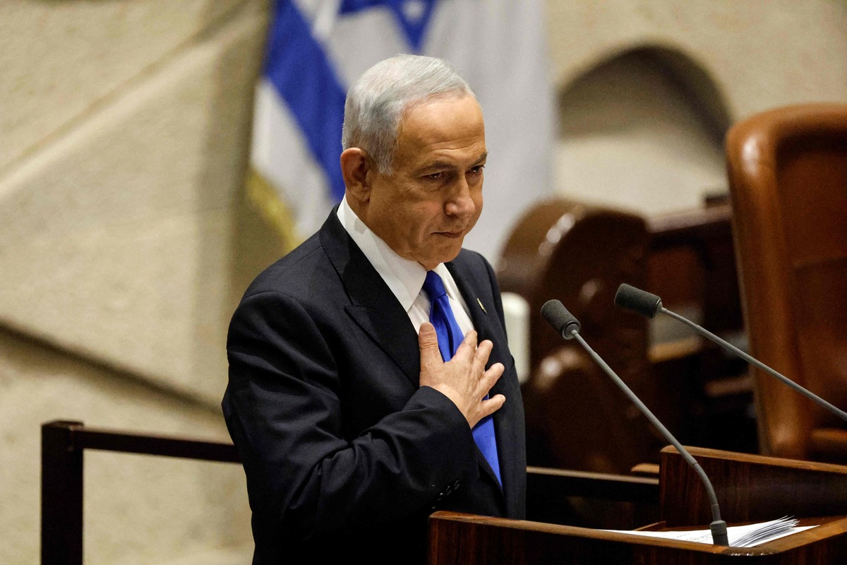 Israel's Prime Minsiter-designate Benjamin Netanyahu presents the new government to parliament at the Knesset in Jerusalem on December 29, 2022 in what analysts described as the most right-wing coalition in Israel's history. The right-wing government, formed after the fifth election in four years, has sparked fears of a further military escalation in the Israeli-occupied West Bank, amid the worst violence there for nearly 20 years. (Photo by AMIR COHEN / POOL / AFP)