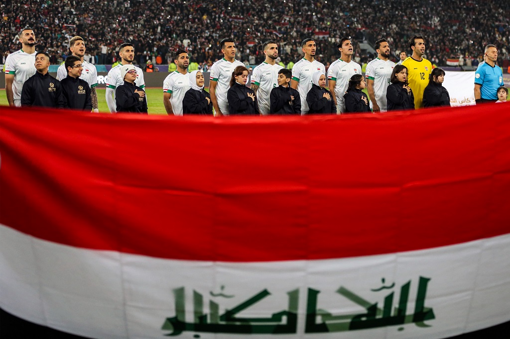 Iraq's starting eleven sing their national anthem before the start of the 25th Arabian Gulf Cup final football match between Iraq and Oman at the Basra International Stadium in Iraq's southern city on January 19, 2023. (Photo by Hussein FALEH / AFP)