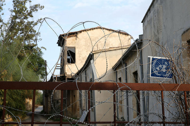 epa08021469 A general view of a barbed wire fence on the UN buffer zone, also known as the 'Green Line', in the divided capital city of Nicosia, Cyprus, 24 November 2019. Cyprus President Nicos Anastasiades and Turkish Cypriot leader Mustafa Akinci will hold a tripartite meeting with UN Secretary-General Antonio Guterres in Berlin on Monday at the historic Hotel Adlon. Cyprus has been divided since 1974, when Turkish troops invaded and occupied its northern third. Turkey has ignored numerous UN resolutions calling for the withdrawal of the Turkish troops and respect of the integrity and sovereignty of the Republic of Cyprus. Repeated rounds of UN-led peace talks have so far failed to yield results. The last round of negotiations, in the summer of 2017, at the Swiss resort of Crans-Montana ended inconclusively. EPA-EFE/KATIA CHRISTODOULOU