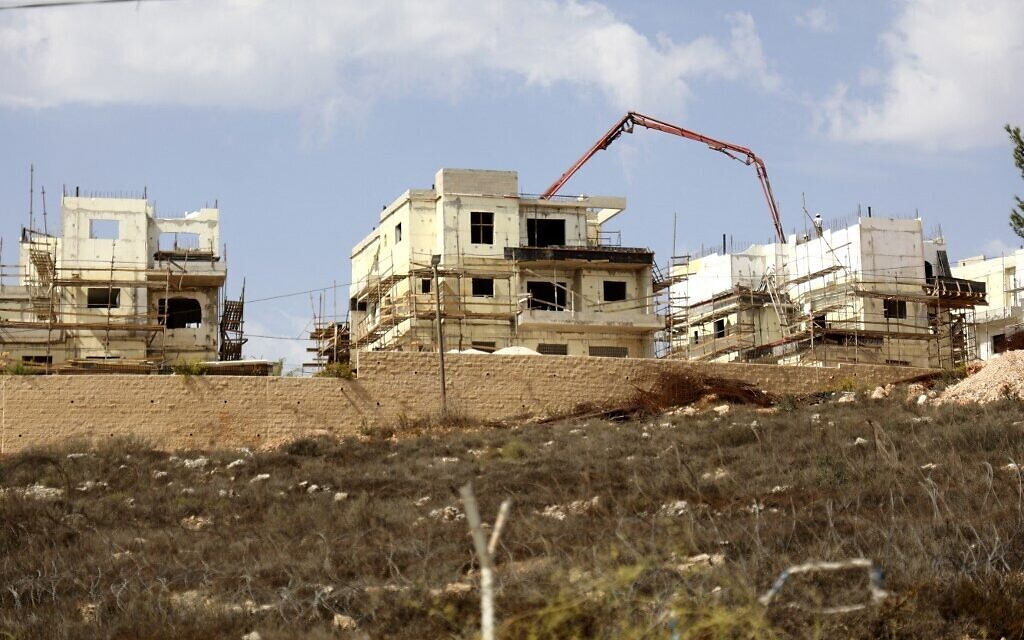 (FILES) This file photo taken on October 13, 2021, shows construction in the Israeli settlement of Rahalim, located near the village of Yatma, south of Nablus in the occupied West Bank. - The United States on October 26, 2021 voiced concern about Israel's decision to build settlements in the West Bank, saying it will "strongly oppose" such expansion on occupied Palestinian land. (Photo by JAAFAR ASHTIYEH / AFP)