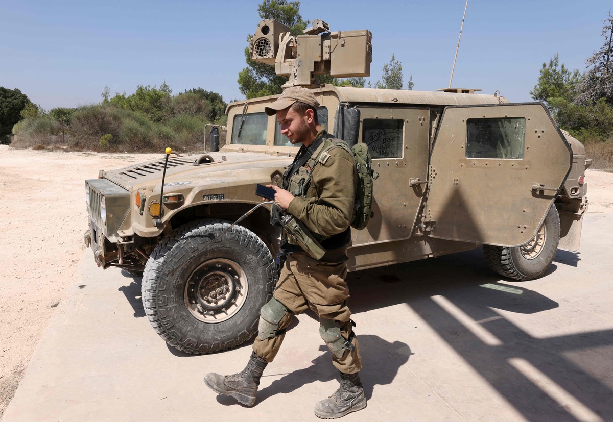 An Israeli soldier is pictured during a military exercise in along the border with Lebanon on September 5, 2022. (Photo by JALAA MAREY / AFP)