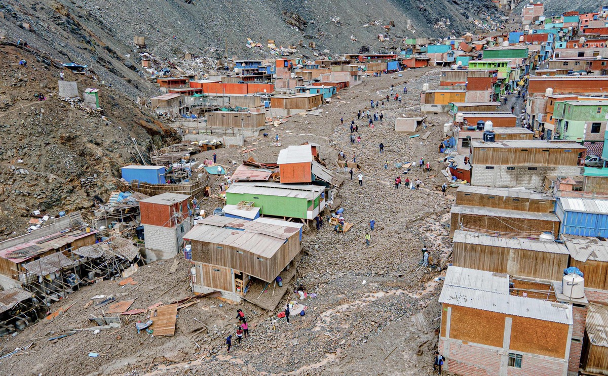 Aerial picture showing the destruction path left by a mudslide caused by heavy rains in Camaná Province, west of Arequipa, in southern Peru, on February 8, 2023,. Peruvian authorities on the eve updated the death toll from devastating mudslides in the country's south over the weekend to 16, with 27 people injured and 20 still missing. In total, more than 12,000 people suffered some form of damage in the disaster that affected Peru's Arequipa region, according to the regional government. (Photo by Diego RAMOS / PERUVIAN NATIONAL POLICE / AFP)