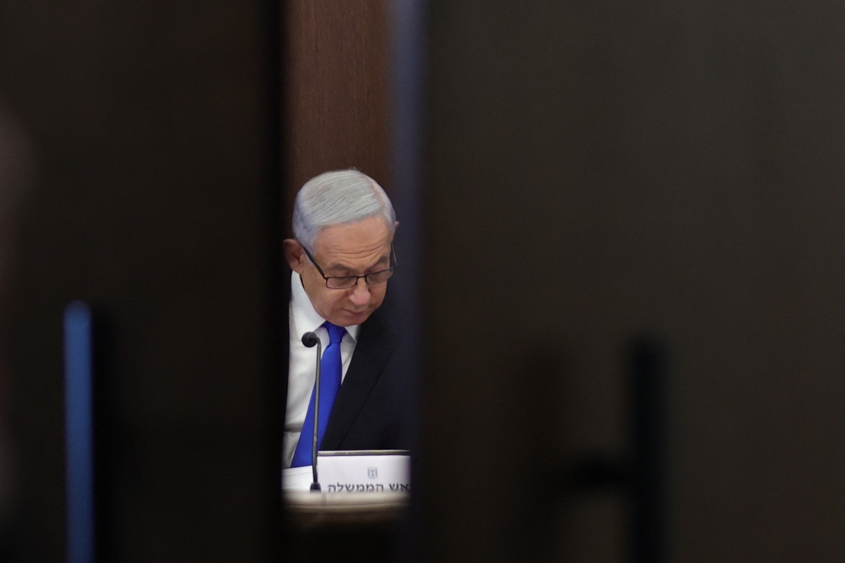 Israeli Prime Minister Benjamin Netanyahu heads the weekly cabinet meeting in his minister's office Jerusalem, on February 19, 2023. (Photo by Abir SULTAN / POOL / AFP)