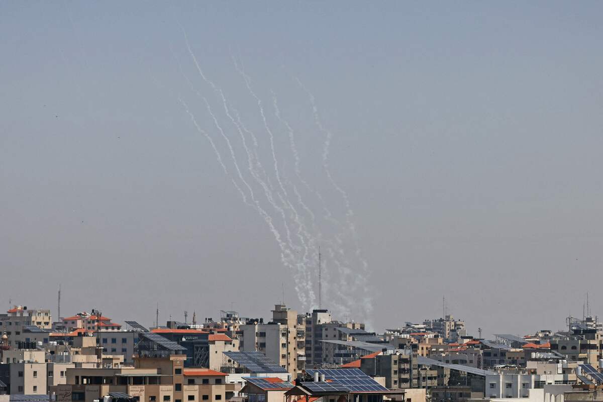 This picture taken from Gaza City shows Palestinian rockets being fired towards Israel on May 11, 2023. The Israeli military said it renewed strikes on Gaza today, killing one person according to the Palestinian territory's health ministry. In a statement, the military said it was "currently striking Islamic Jihad terrorist organisation rocket launching infrastructure in the Gaza Strip". (Photo by Mahmud HAMS / AFP)