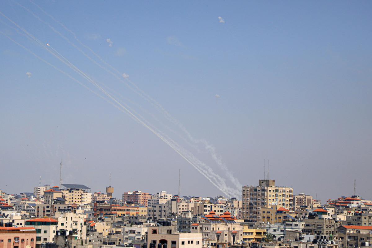 (230510) -- GAZA, May 10, 2023 (Xinhua) -- A barrage of rockets fired from Gaza into Israel are seen in the sky over Gaza City, on May 10, 2023. The Gaza-based joint chamber of military operations of Palestinian factions claimed firing a barrage of rockets to southern and central Israel on Wednesday, in response to the surprising Israeli airstrikes on Tuesday predawn, which killed three senior members of the Palestinian Islamic Jihad (PIJ) movement's armed wing in the Gaza Strip and their wives and children. (Photo by Rizek Abdeljawad/Xinhua)