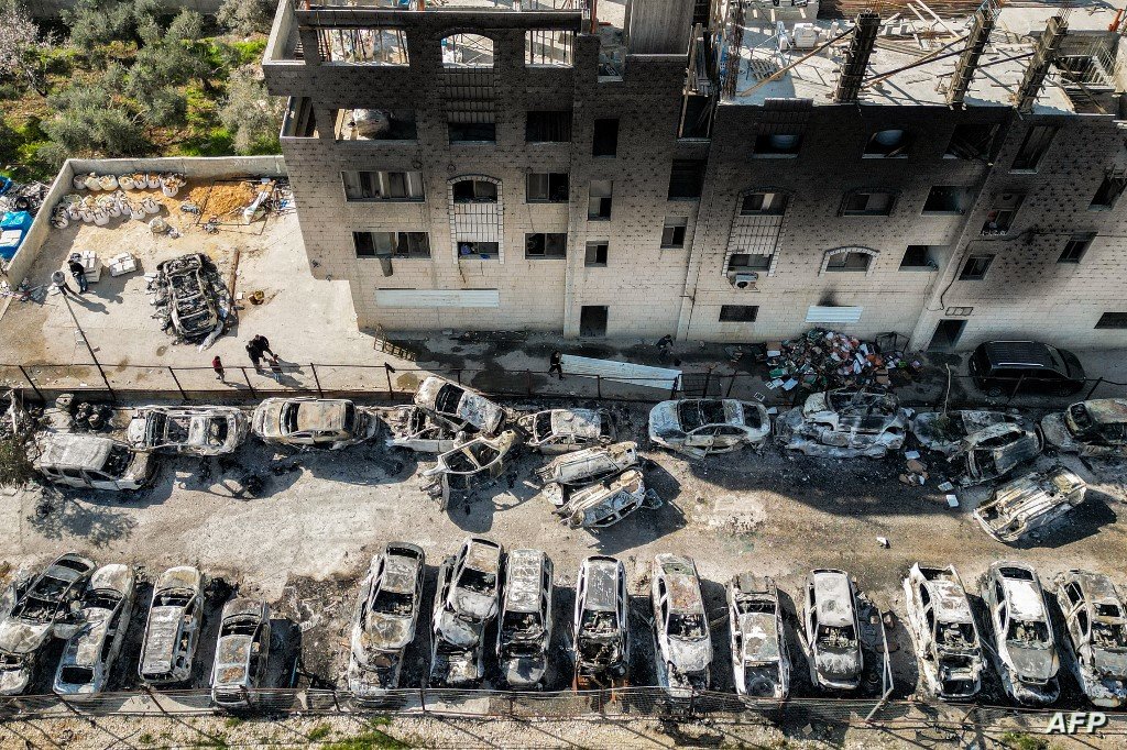 This picture taken on February 27, 2023 shows an aerial view of a scrapyard where cars were torched overnight, in the Palestinian town of Huwara near Nablus in the occupied West Bank. - Two Israelis living in the Har Bracha settlement near Nablus were killed on February 26 in a "Palestinian terror attack", officials said, sparking violence in which a Palestinian man was killed, while settlers torched homes in revenge. (Photo by RONALDO SCHEMIDT / AFP)