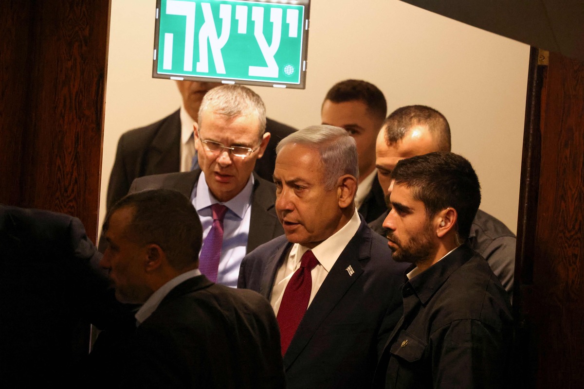 Israeli Prime Minister Benjamin Netanyahu arrives to cast his vote at the parliament, the Knesset, in Jerusalem on June 14, 2023. Netanyahu, leading the most right-wing government in Israel's history, has proposed curtailing the authority of the Supreme Court and giving politicians greater powers over the selection of judges. (Photo by Menahem KAHANA / AFP)