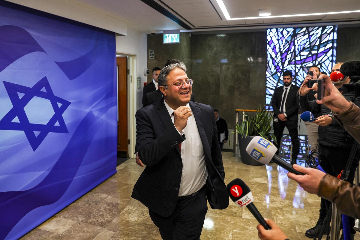 Israel's National Security Minister Itamar Ben-Gvir (C) speaks to reporters as he arrives for the weekly meeting at the prime minister's office in Jerusalem on April 2, 2023. (Photo by RONEN ZVULUN / POOL / AFP)