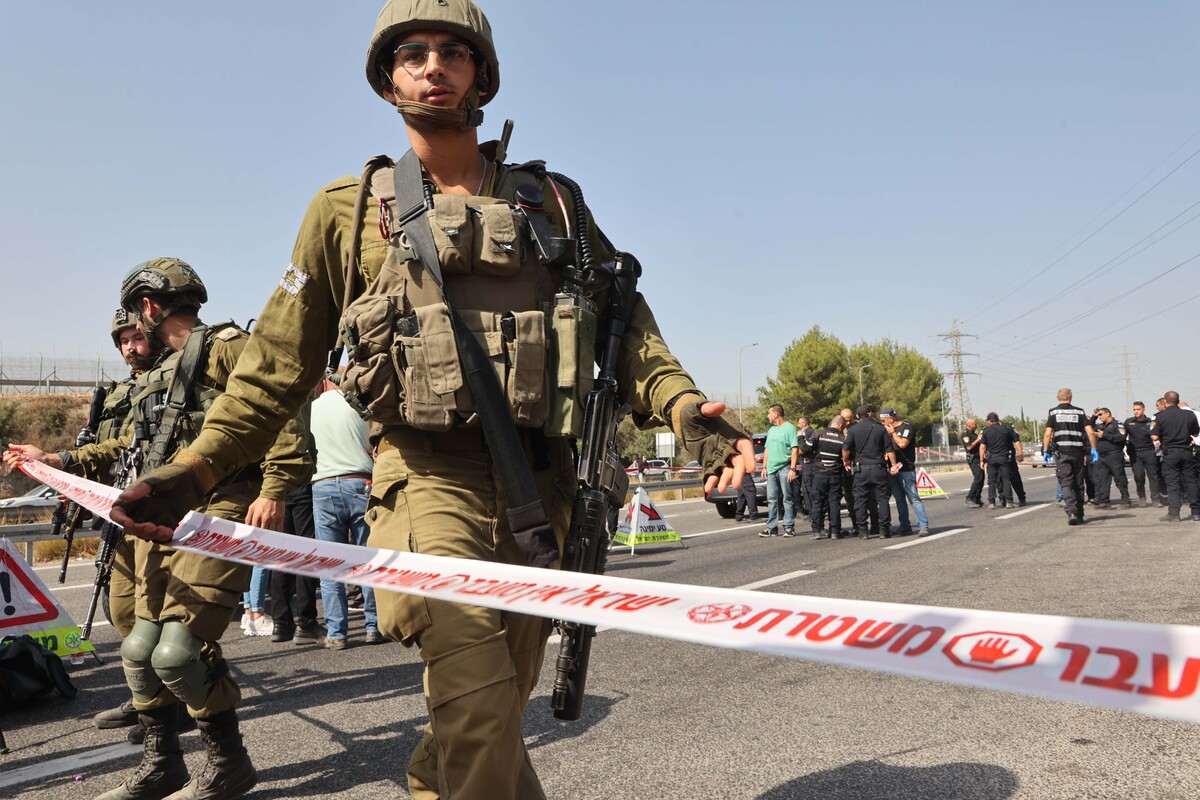 (230831) -- MODIIN, Aug. 31, 2023 (Xinhua) -- Israeli soldiers stand guard at the site of a car-ramming attack near the Maccabim checkpoint to the West Bank, near the central Israeli city of Modiin, Aug. 31, 2023. A Palestinian truck driver rammed into Israelis near a checkpoint in the occupied West Bank on Thursday, killing one and injuring five, before being shot and killed by soldiers. (Photo by Gil Cohen Magen/Xinhua)