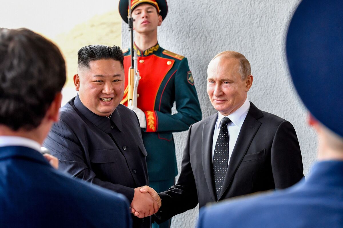 (FILES) Russian President Vladimir Putin welcomes North Korean leader Kim Jong Un prior to their talks at the Far Eastern Federal University campus on Russky island in the far-eastern Russian port of Vladivostok on April 25, 2019. North Korean leader Kim Jong Un will visit Russia and hold a summit with President Vladimir Putin, Pyongyang state media said on September 11, 2023, after South Korean media reported Kim's train had departed. (Photo by Yuri KADOBNOV / AFP)