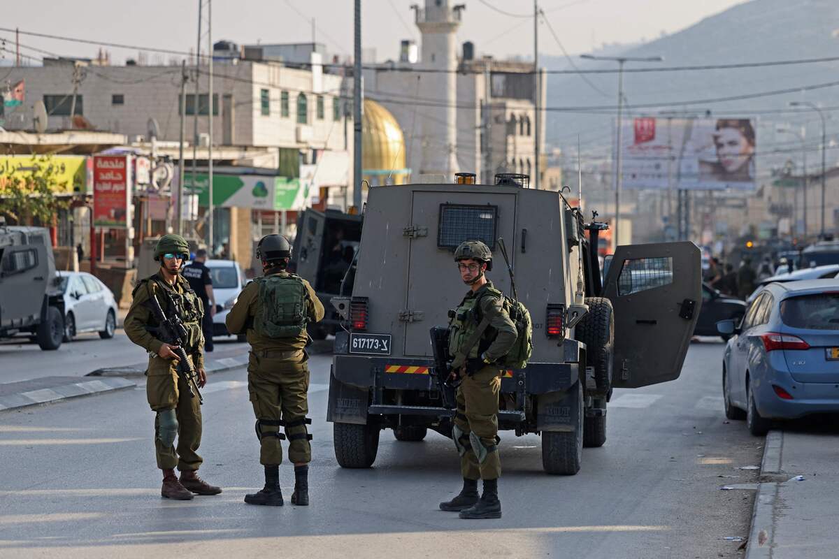 Security forces deploy in the occupied West Bank town of Huwara on February 26, 2023 following the death of two Israelis in a shooting attack. (Photo by AHMAD GHARABLI / AFP)