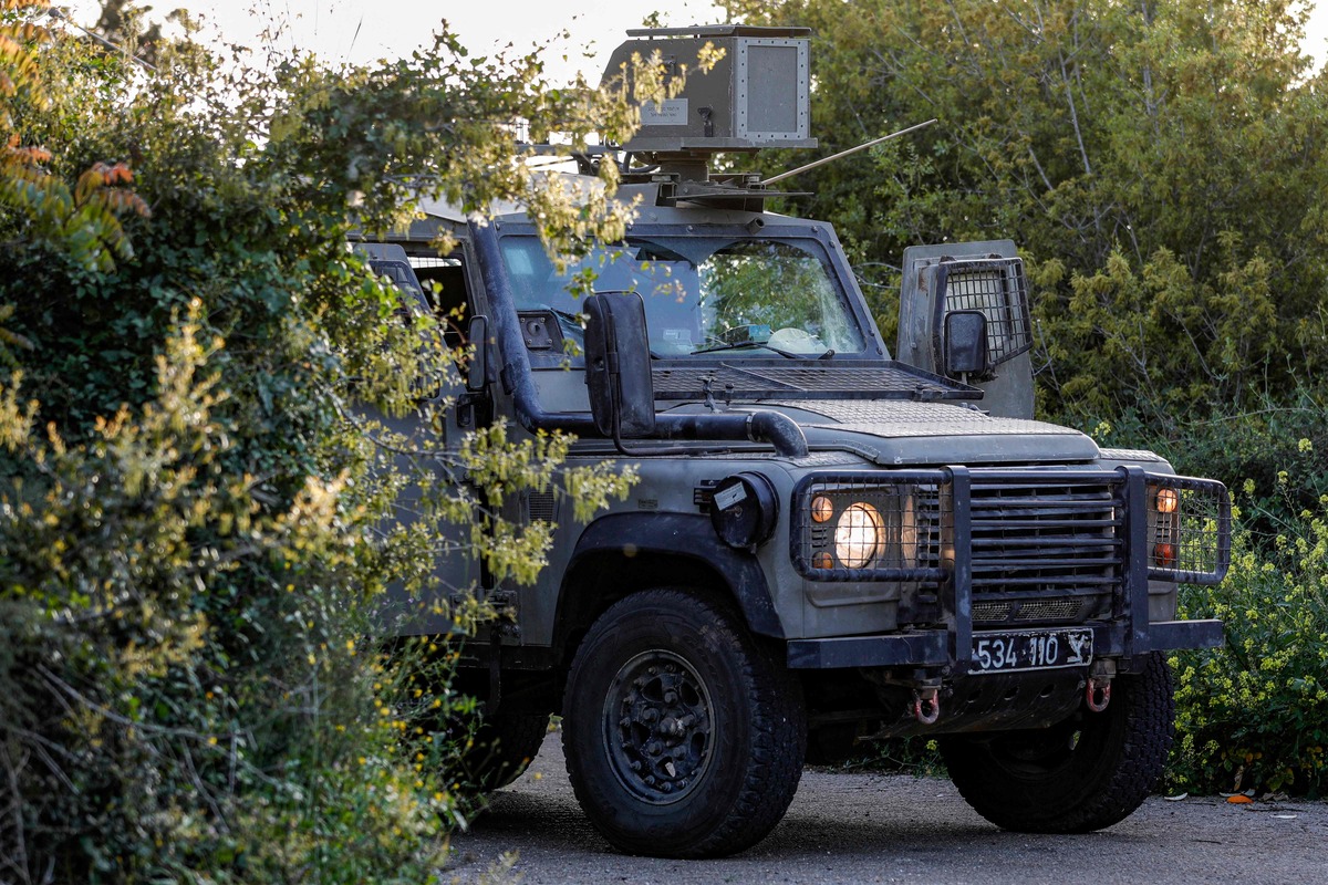 An Israeli military vehicle is stationed along the border with southern Lebanon near Israel's northern village of Shtula on April 6, 2023. The Israeli army said it intercepted rocket fire from Lebanon on April 6 after clashes between Israeli police and Palestinians inside Islam's third-holiest site drew warnings of retaliation from around the region. (Photo by Jalaa MAREY / AFP)