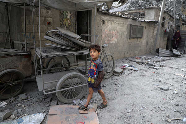 (231025) -- GAZA, Oct. 25, 2023 (Xinhua) -- A Palestinian boy walks on a street after Israeli airstrikes in the Southern Gaza Strip city of Khan Younis, Oct. 25, 2023. The death toll of Palestinians from Israeli airstrikes on the Gaza Strip has risen to 6,546, the Hamas-run Health Ministry said on Wednesday. (Photo by Rizek Abdeljawad/Xinhua)