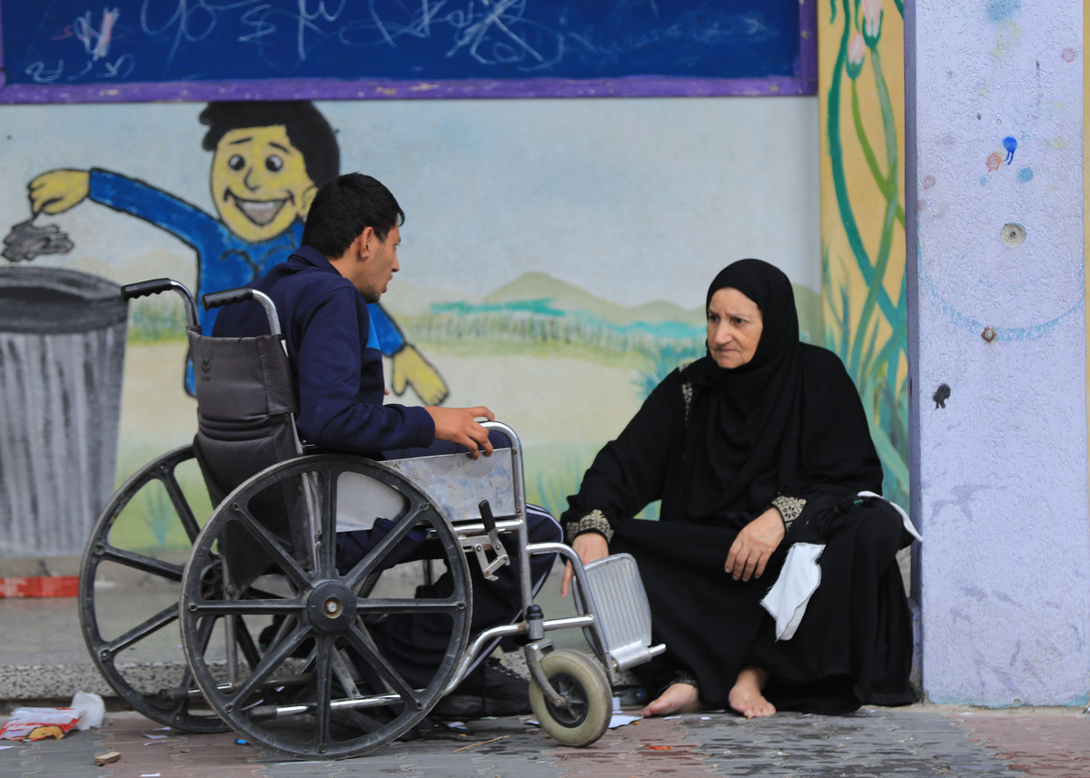 (231009) -- GAZA, Oct. 9, 2023 (Xinhua) -- Palestinian people who fled their homes due to Israeli air strikes and artillery shelling take refuge at a school in the southern Gaza Strip city of Khan Younis, Oct. 9, 2023. At least 493 Palestinians have been killed and 2,751 others wounded in Israeli airstrikes on the Gaza Strip, the Hamas-run health ministry said on Monday. At least 800 people have been killed in the mass assault launched by the Palestinian Islamic Resistance Movement (Hamas) on Israel, Israel's state-owned Kan TV news reported on Monday. (Photo by Yasser Qudih/Xinhua)