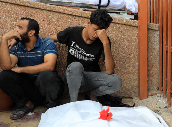 (231027) -- KHAN YOUNIS, Oct. 27, 2023 (Xinhua) -- People mourn for their relatives at a medical center in the southern Gaza Strip city of Khan Younis, Oct. 27, 2023. The death toll of Palestinians from Israeli military strikes on the Gaza Strip has risen to 7,326, the Hamas-run Health Ministry said on Friday. Israel has launched massive airstrikes and limited ground operations against Gaza in retaliation for a surprise attack by Gaza-ruling Hamas militants on Israeli military targets and towns on Oct. 7, which has killed at least 1,400 people in Israel. (Photo by Yasser Qudih/Xinhua)