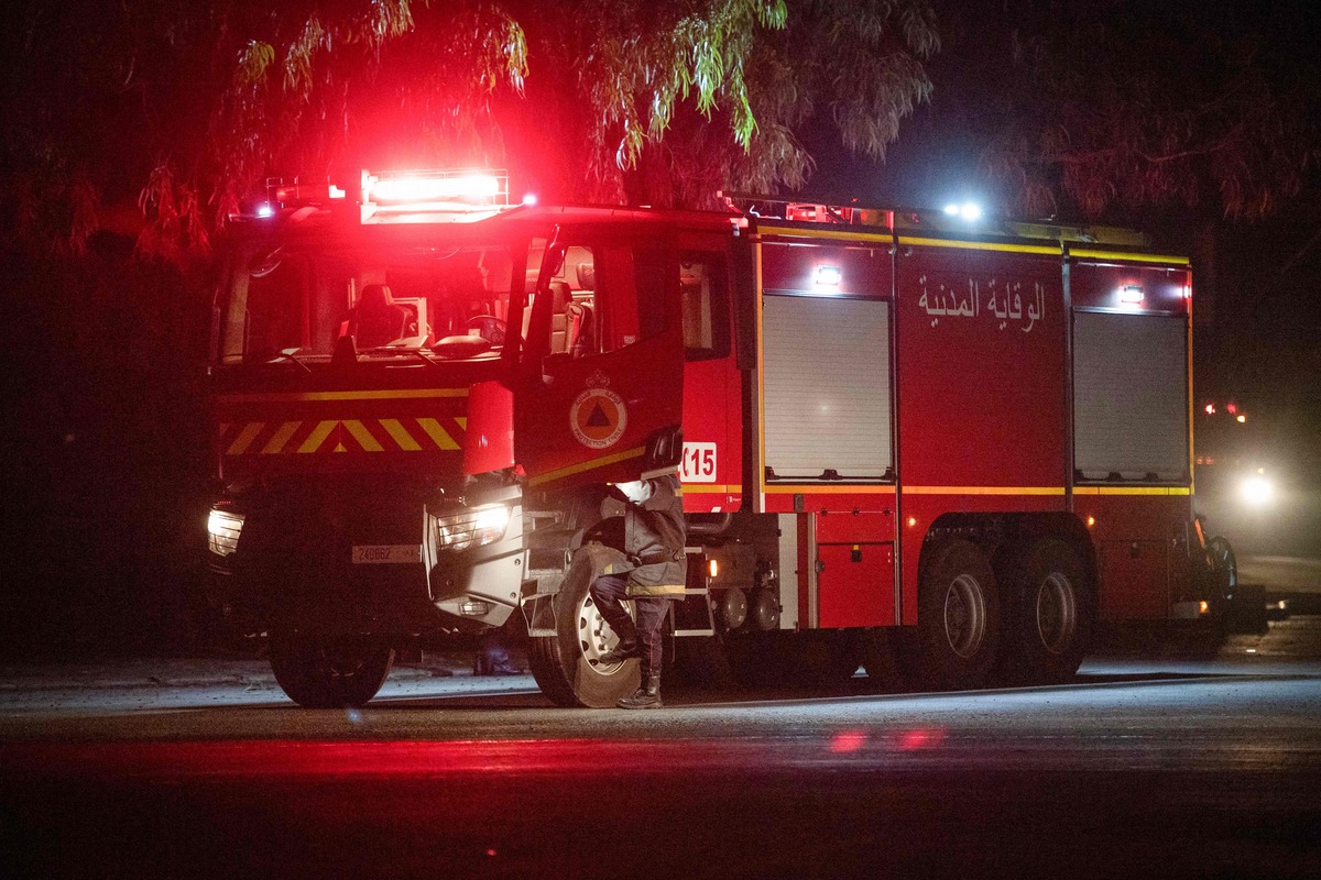 A fire truck is driven along a street after a fire at a gas depot in the city of Mohammedia on December 22, 2022. (Photo by AFP)