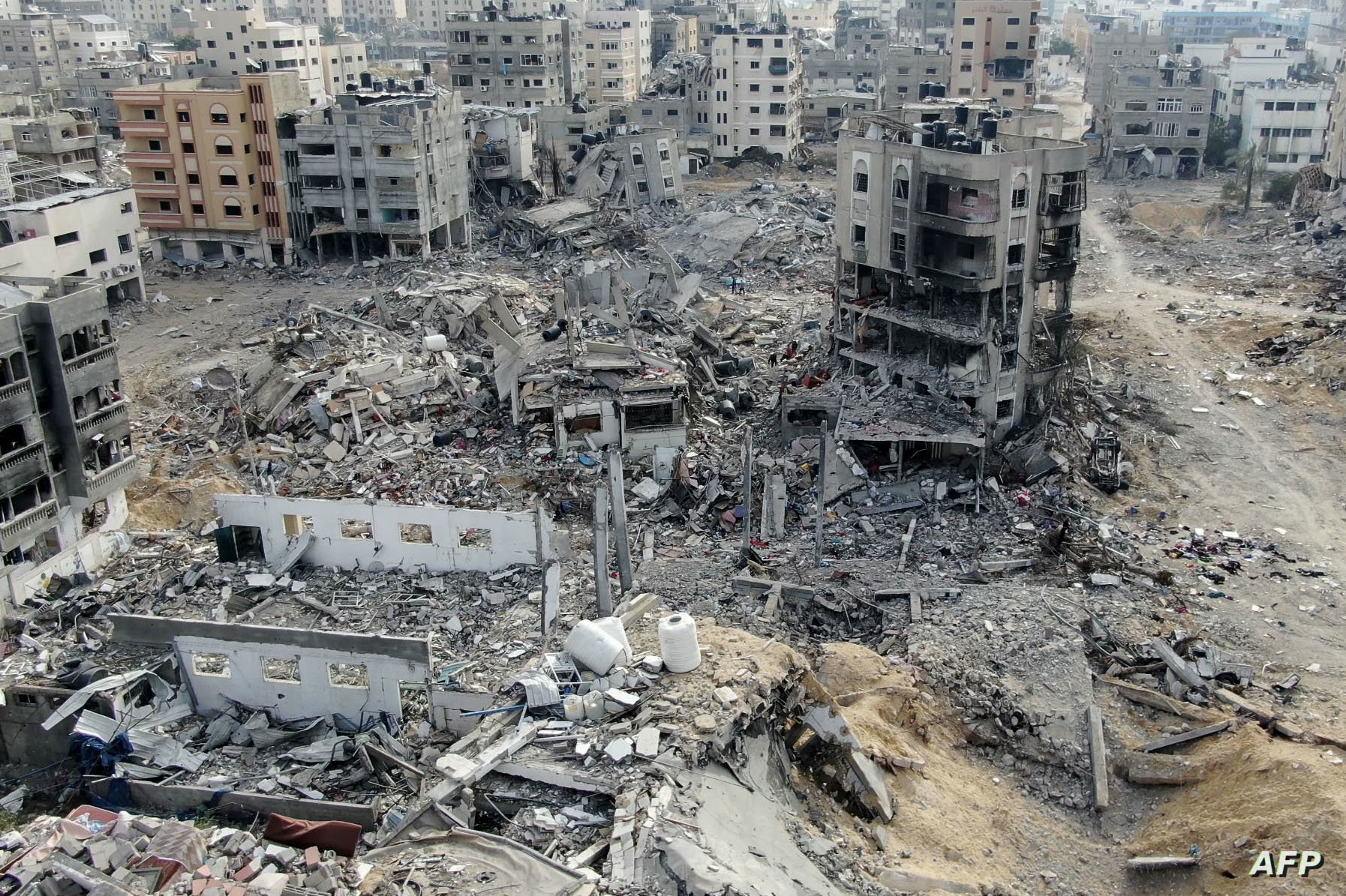 An aerial view on December 26, 2023 shows destroyed buildings in Beit Lahia following Israeli bombardments in the northern Gaza Strip, amid ongoing battles between Israel and the Palestinian militant group Hamas. (Photo by AFP)