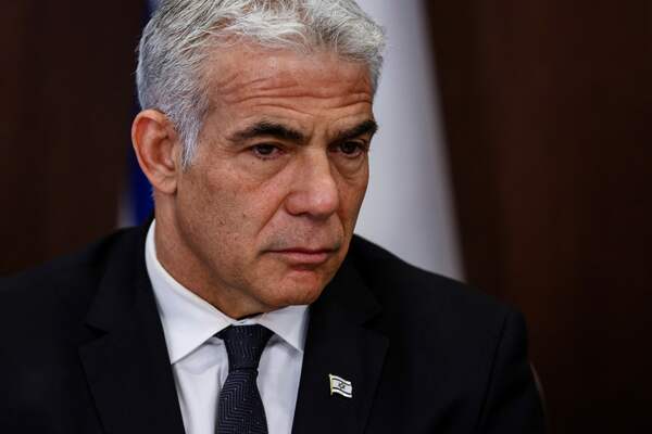 Israeli Foreign Minister Yair Lapid attends a cabinet meeting at the Prime Minister's office in Jerusalem, on June 26, 2022. (Photo by RONEN ZVULUN / POOL / AFP)