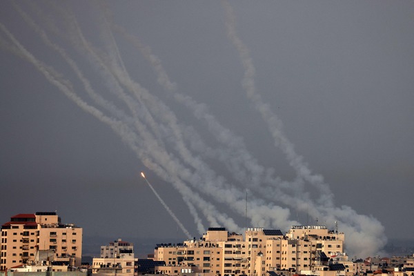 Rockets are launched toward Israel from Gaza City on May 11, 2023, on the third day of the worst escalation of violence in months that has killed 25 people in the blockaded Palestinian enclave. Air strikes by the Israeli army since May 9 have killed fighters as well as civilians, including several children, said officials in the crowded coastal territory. (Photo by MAHMUD HAMS / AFP)