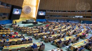 A wide view of the General Assembly Hall as Philemon Yang (at podium and on screens), President of the seventy-ninth session of the United Nations General Assembly, addresses the resumed 10th Emergency Special Session of the General Assembly on “Illegal Israeli actions in occupied East Jerusalem and the rest of the Occupied Palestinian Territory”.