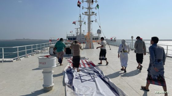 People tour the deck of the Galaxy Leader commercial ship, seized by Yemen's Houthis last month, off the coast of al-Salif, Yemen December 5, 2023. REUTERS/Khaled Abdullah