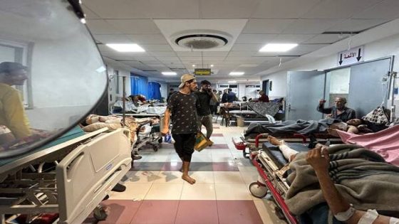 EDITORS NOTE: Graphic content / Men walk as Patients rest at Al-Shifa hospital in Gaza City on November 10, 2023, amid ongoing battles between Israel and the Palestinian Hamas movement. Heavy fighting was raging near Al-Shifa hospital, with Israel saying it had killed dozens of militants and destroyed tunnels that are key to Hamas's capacity to fight. Israel launched an offensive in Gaza after Hamas fighters poured across the heavily militarised border on October 7, killing 1,400 people, mostly civilians, and taking around 240 hostages. (Photo by Ismail Zanoun / AFP)