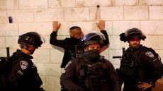 Israeli security forces detain a man as they clash with Palestinians following the funeral of Walid al-Sharif, 23, who died of wounds suffered last month during clashes with Israeli police at Jerusalem's flashpoint al-Aqsa mosque compound, on May 16, 2022 outside the Old City of Jerusalem. - Sharif, 23, was taken to Hadassah Ein Kerem hospital with a "head injury" on April 22 and he was "pronounced dead this morning", the hospital said in a statement. (Photo by Ahmad GHARABLI / AFP) (Photo by AHMAD GHARABLI/AFP via Getty Images)